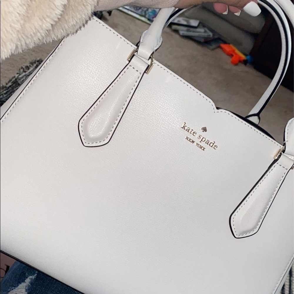 A White Kate Spade Purse with black wallet. - Picture 1 of 2